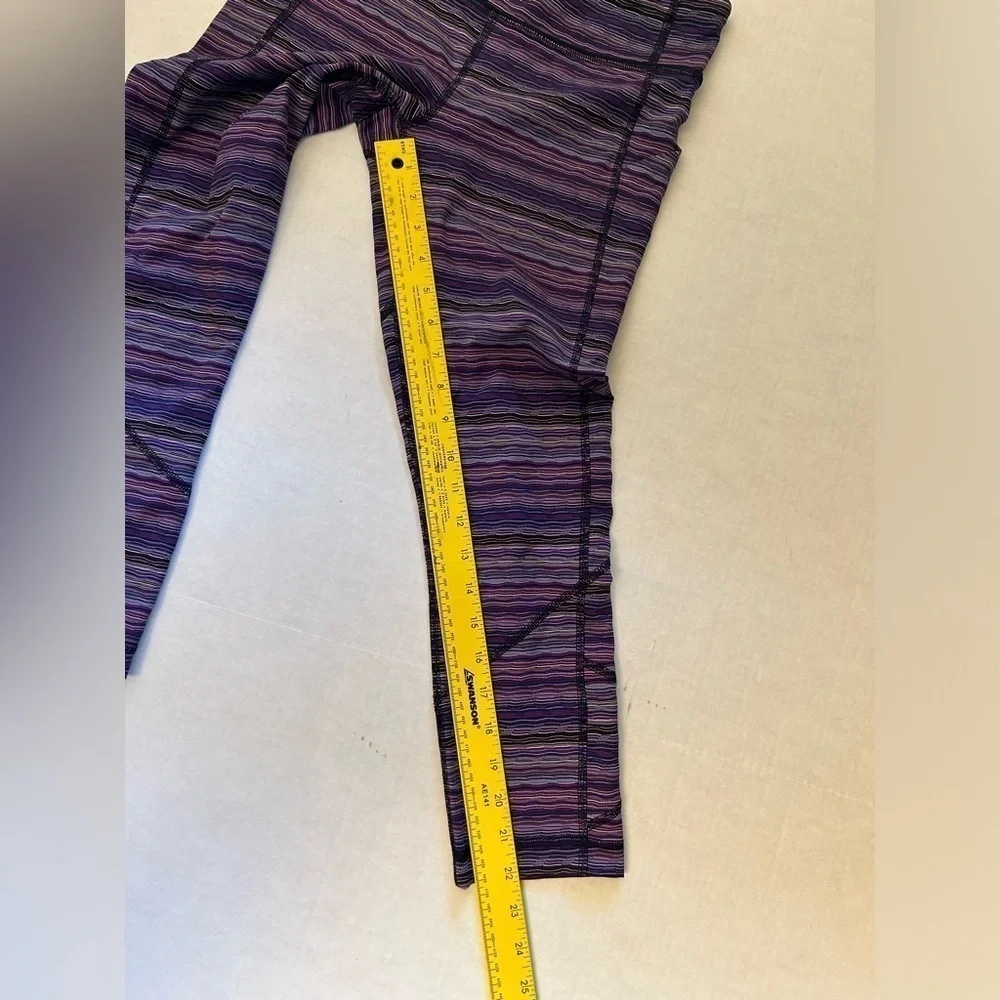 Lululemon striped purple legging w/back zip pocket & 2‎ side pockets Sz-6. Z19